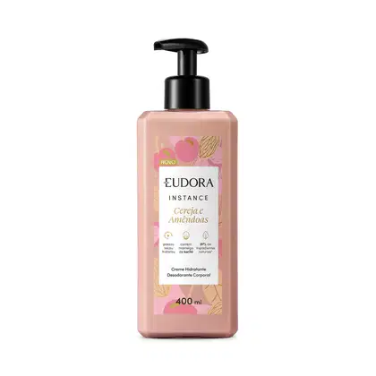 Embalagem plástica de 400ml com bomba dosadora preta. A embalagem é rosa claro com ilustrações florais em tons de rosa e amarelo. O rótulo indica que é da linha "Cereja e Amendoas" e contém 97% de ingredientes naturais.