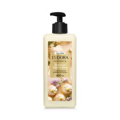 Frasco plástico transparente 400ml com bomba dosadora preta, produto em cor verde-limão claríssimo. Rótulo com fundo bege claro, apresentando imagens de flores e doces de limão. Retângulo dourado ao centro com o nome do produto em preto e branco.