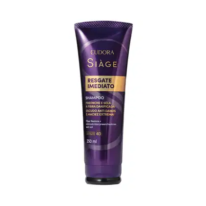 Embalagem plástica tubular de cor roxa escura com detalhes em dourado. Logotipo da marca Eudora e linha Siàge visíveis em dourado. Ao fundo, em roxo mais claro, a letra S de Siàge.