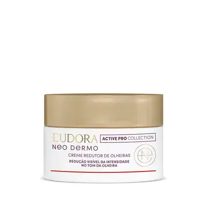 Embalagem topo pote do Creme redutor de olheiras da linha Neo Dermo da Eudora. Embalagem branca, redonda com tampa de rosquear dourada, rótulo em tons dourados no fundo branco com informações sobre a redução visível da intensidade das olheiras.