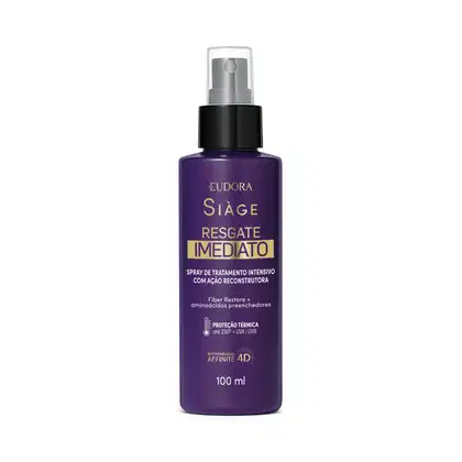Embalagem plástica roxa com rótulo em letras douradas e brancas. Possui aplicador spray na parte superior, na cor preta com tampa de proteção transparente.