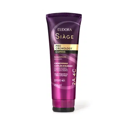 O produto apresentado é um Shampoo da linha Siàge Pro Cronology Curvas. A embalagem é um tubo de plástico de cor roxa com detalhes em dourado. O rótulo indica que conta com a tecnologia "Affinity 4D" e promete um cronograma capilar acelerado.