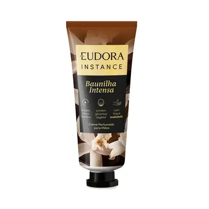Embalagem de creme perfumado para mãos da marca Eudora Instance, com rótulo amarelo e preto destacando a fragrância "Baunilha Intensa". O produto contém glicerina vegetal e é livre de parabenos.