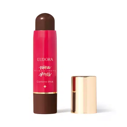 O produto apresentado é um contorno em bastão da linha Niina Secrets. A embalagem é cilíndrica e de cor rosa vibrante, com o nome da marca e da linha impressos em letras douradas. A embalagem também possui um detalhe dourado na parte superior.