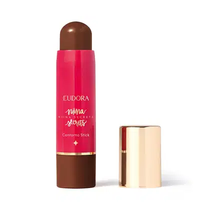 O produto apresentado é um contorno em bastão da linha Niina Secrets. A embalagem é cilíndrica e de cor rosa vibrante, com o nome da marca e da linha impressos em letras douradas. A embalagem também possui um detalhe dourado na parte superior.