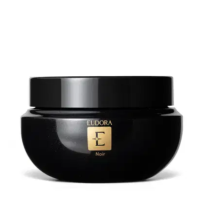 Pote preto de hidratante corporal da marca Eudora, com tampa preta e rótulo dourado com a letra "E" em destaque. O produto é da linha Noir, com design elegante e sofisticado.