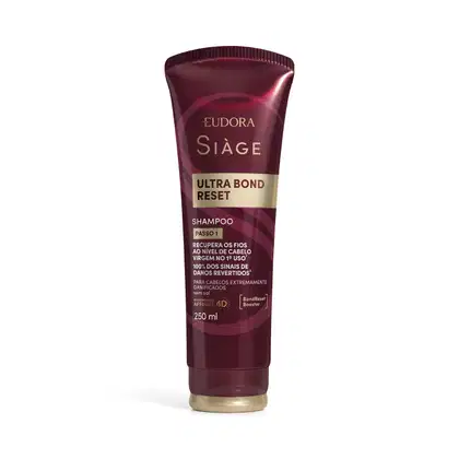 Frasco de shampoo da marca Siàge, na cor vinho, com rótulo em dourado contendo o texto "Ultra Bond Reset" e informações sobre recuperação dos fios.