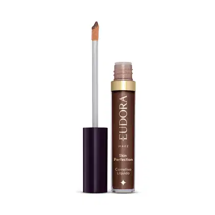 Produto de maquiagem da marca Eudora, com embalagem em tons de marrom e dourado. Trata-se de um corretivo líquido para a pele, o produto está aberto e mostrando como é o aplicador.
