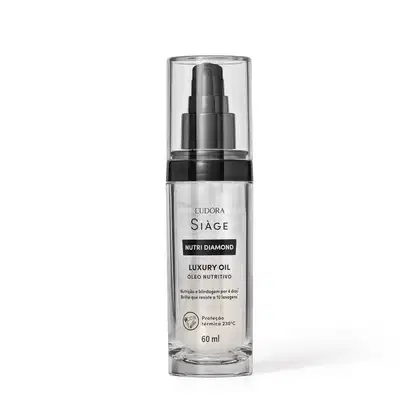 Frasco transparente contendo Luxury Oil da marca Eudora Siage Nutri Diamond. O produto possui rótulo com texto em preto indicando o nome da linha "Siàge Nutri Diamond", que possui proteção térmica e o volume de 60 ml.
