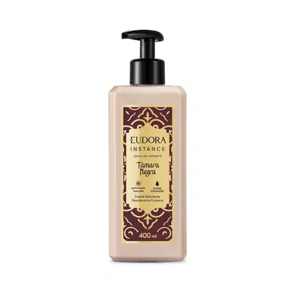 Frasco de plástico com bomba doseadora preta, rótulo com design dourado e marrom, contendo item de cuidados corporais da marca Instance Joias do Oriente com fragrância de Tâmara Negra.
