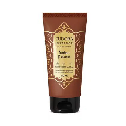 Frasco de creme hidratante desodorante concentrado ultra perfumado da marca Eudora Instance, com embalagem marrom e dourada, rótulo com texto "Âmbar Precioso" e desenhos ornamentais decorativos.