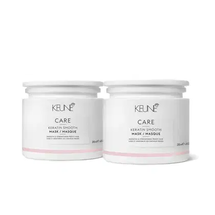 Dois frascos brancos da linha Keune Care, contendo a máscara alisadora de queratina. Os rótulos apresentam o nome da marca e do produto em letras pretas.