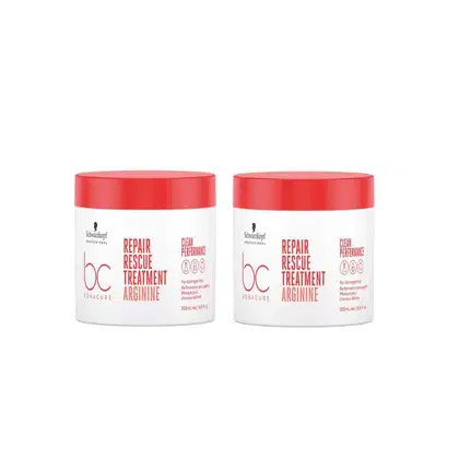 Dois potes brancos com tampas vermelhas da linha Bonacure Repair Rescue Treatment Arginine da Schwarzkopf Professional, contendo tratamento para cabelos danificados.