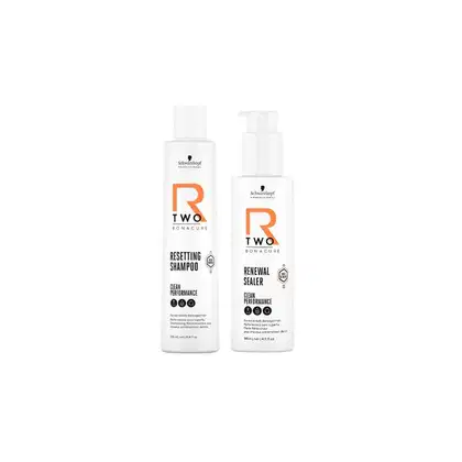 Dois frascos brancos da linha R Two Bonacure da Schwarzkopf Professional: um com rótulo laranja para Shampoo Revitalizante e outro com rótulo laranja para Selante de Renovação, ambos com design minimalista.