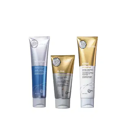 Três produtos Joico: um bálsamo de tratamento para recuperação da umidade, um tratamento de reconstrução profunda e um tratamento intenso de hidratação, em embalagens de plástico com rótulos em tons de azul, prata e dourado.