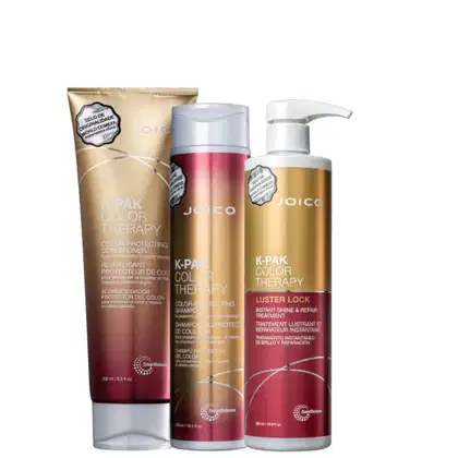 Três produtos da linha Joico K-Pak Color Therapy: um condicionador em tubo dourado, um shampoo em frasco rosa e branco, e um tratamento instantâneo em frasco branco e rosa.