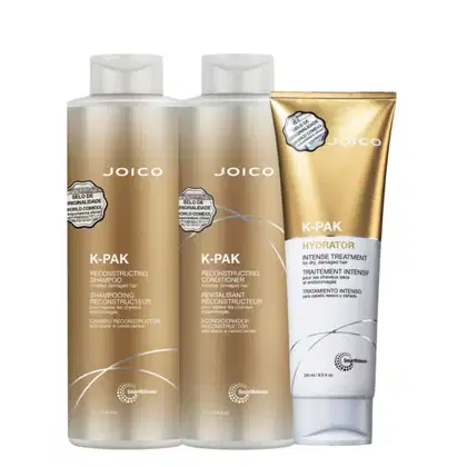Conjunto de produtos Joico K-Pak, incluindo shampoo e condicionador reconstrutor, além de tratamento intensivo para cabelos secos e danificados, em embalagens de plástico e metal com design elegante e detalhes em dourado.