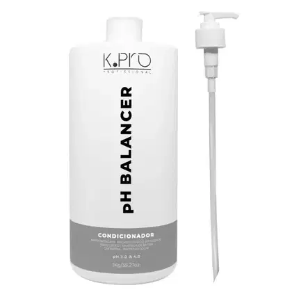 Frasco branco de condicionador da marca K.pro Professional, com rótulo preto destacando "PH BALANCER". Embalagem com bomba dosadora.