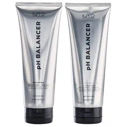Dois tubos de produtos de cabelo da marca K.pro, um shampoo e um condicionador, com embalagens prateadas e preto.