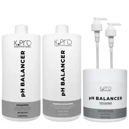 Conjunto de produtos de cuidados capilares da marca K.Pro, incluindo shampoo, condicionador e máscara capilar, em embalagens brancas e cinzas com rótulos em preto. Acompanha 2 válvulas pump.