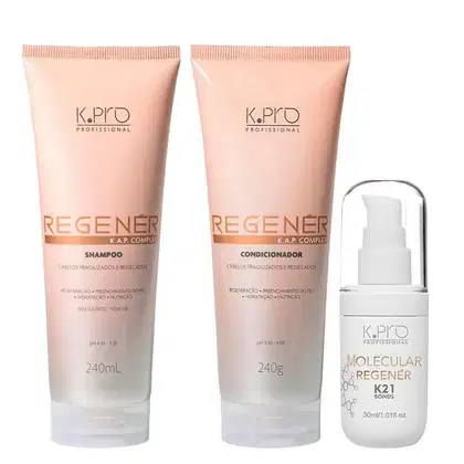 Conjunto de produtos de cuidados capilares da marca K.pro, incluindo shampoo e condicionador em embalagens de plástico nas cores rosa e branco. Também conta com tubo de leave-in Molecular Repair Regenér K21 Bonds.