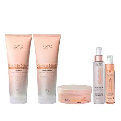 Conjunto de produtos de cuidados capilares da marca K.pro, incluindo shampoo, condicionador, máscara, leave-in e óleo capilar em embalagens de plástico nas cores rosa e branco.