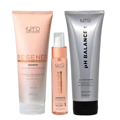 Conjunto de produtos de cuidados capilares da marca K.pro, incluindo shampoo e óleo capilar em embalagens de plástico nas cores rosa e branco. Também conta com tubo de acidificante pH Balancer.