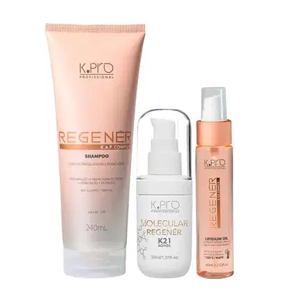 Conjunto de produtos de cuidados capilares da marca K.pro, incluindo shampoo e óleo em embalagens de plástico nas cores rosa e branco. Também conta com tubo de leave-in Molecular Repair Regenér K21 Bonds.