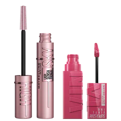 A imagem mostra produtos de maquiagem da Maybelline: uma máscara de gelo em embalagem rosa metálica e um batom líquido matte rosado. Todos os itens têm tonalidades rosadas e metálicas, focados em maquiagem para lábios e cílios.