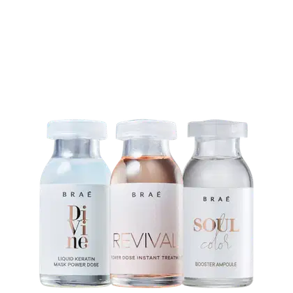 A imagem mostra três frascos de vidro transparente com tampas brancas, contendo líquidos de diferentes cores - branco, rosa e incolor. Os frascos têm rótulos com o nome da marca "BRAÉ" e os nomes das linhas: "Divine", "Revival" e "Soul Color".