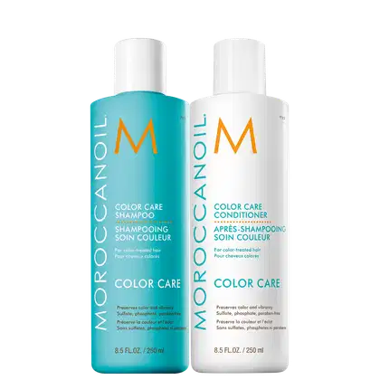 A imagem mostra o Shampoo e Condicionador Moroccanoil Color Care 250ml cada. Dois frascos cilíndricos de plástico branco, um na cor azul turquesa e outro branco. Trazem logotipo "M" laranja. Os produtos visam preservar a cor dos cabelos coloridos.