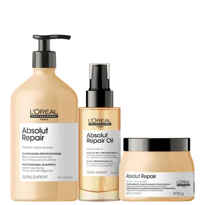 A imagem mostra três produtos da linha Absolut Repair da L'Oréal Professionnel: um frasco de shampoo, um frasco de óleo de reparação e um pote de tratamento condicionante.