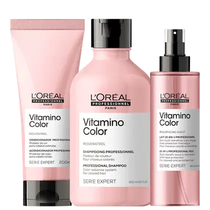 A imagem mostra três produtos da linha Vitamino Color da L'Oréal Professionnel para cabelos coloridos. Um condicionador, um shampoo profissional e um tratamento leave-in 10 em 1.