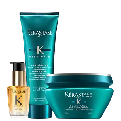 A imagem mostra shampoo e máscara da linha Resistance da marca Kérastase, com frascos em tom azul-esverdeado e óleo capilar Elixir Ultime com frasco transparente, permitindo ver o líquido dourado dentro.