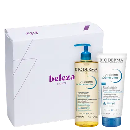A imagem mostra caixa branca presenteável da marca Beleza na Web e dois produtos da marca Bioderma da linha Atoderm: um  óleo de banho Atoderm 200ml e um creme hidratante Atoderm Creme Ultra de 200ml.