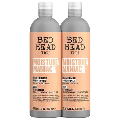 Dois frascos de condicionador hidratante da linha Bed Head da TIGI, com rótulos em tons de laranja e cinza, apresentando o nome "Moisture Maniac" e informações sobre o produto.