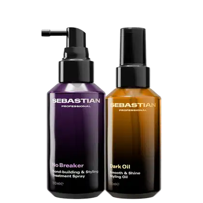 Dois frascos de produtos profissionais da marca Sebastian, um com rótulo roxo "No Breaker" e outro com rótulo dourado "Dark Oil Smooth & Shine Styling Oil", ambos com embalagens pretas e bombas de spray.
