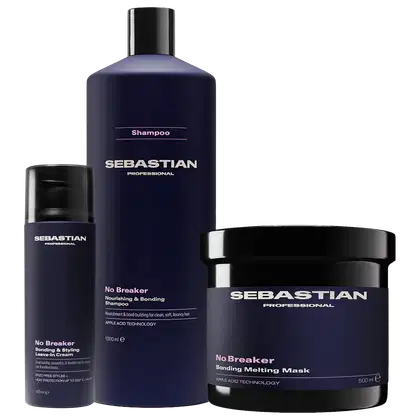 Produtos de cabelo da marca Sebastian Professional, incluindo um frasco de shampoo, um creme de tratamento e uma máscara, todos em embalagens em azul escuro com detalhes em rosa e branco.