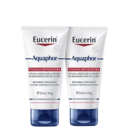 Dois tubos de pomada reparadora Eucerin Aquaphor, com embalagem branca e azul, contendo 55ml/49g cada. O rótulo destaca o nome da marca e o produto "Pomada Reparadora"