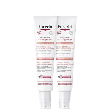 Dois tubos de serum corporal anti-manchas Anti-Pigment da marca Eucerin, de 75ml cada, com embalagem branca e rosa e texto destacando os benefícios do produto para uniformizar o tom da pele.