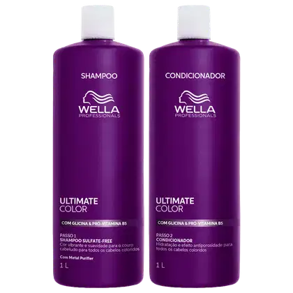 Dois frascos de 1 litro da linha Ultimate Color da Wella Professionals, um de shampoo e outro de condicionador, com embalagem roxa e detalhes em branco, indicando tratamento para cabelos coloridos.