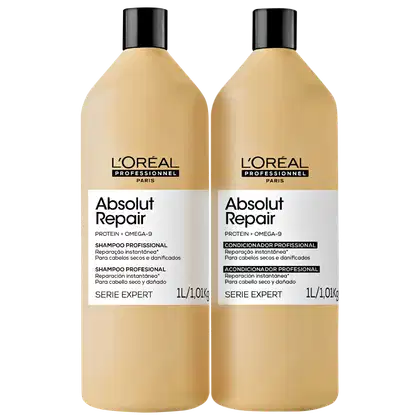 Dois frascos de shampoo e condicionador da linha Absolut Repair da L'Oréal Professionnel, com embalagens em tons de bege e preto, contendo informações sobre os produtos na frente.