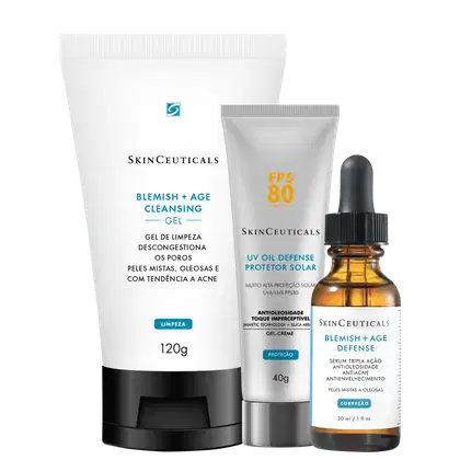 Kit SkinCeuticals com três produtos: gel de limpeza 120g, protetor solar FPS 80 40g e sérum defense 30ml. Embalagens brancas, cinzas e frasco âmbar com aplicador conta-gotas.