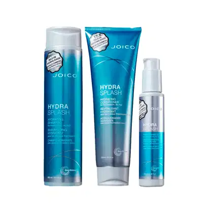 Produtos de cuidados capilares da marca Joico, incluindo shampoo, condicionador e spray hidratante, em embalagens com cores predominantes de azul e branco, com rótulos indicando os nomes "Hydra Splash".