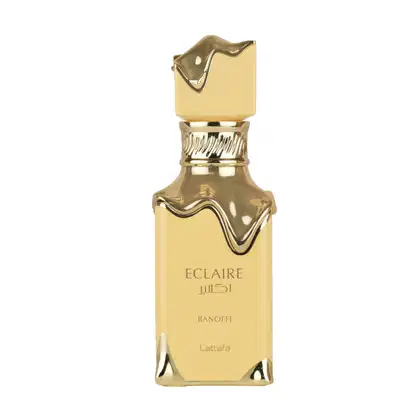 Frasco de perfume dourado da marca Lattafa, com o nome "Eclaire" e "Banoffi" impresso no rótulo. O design é elegante e sofisticado, com detalhes decorativos na tampa e no corpo do frasco.