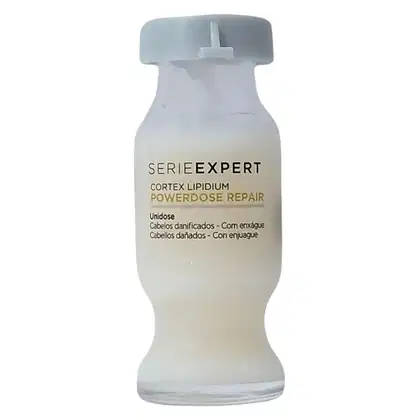 Frasco branco da linha Serie Expert da L'Oréal Professionnel, contendo o produto Cortex Lipidium Powerdose Repair, com rótulo destacando os benefícios de unidose para cabelos danificados e com enjágue.