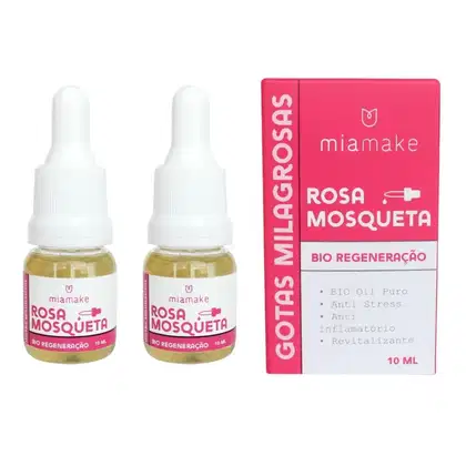 Dois frascos de óleo de Rosa Mosqueta da marca Miamake, com 10 ml cada, em embalagem rosa com texto informativo sobre os benefícios do produto, como bio regeneração, anti stress e anti inflamatório.