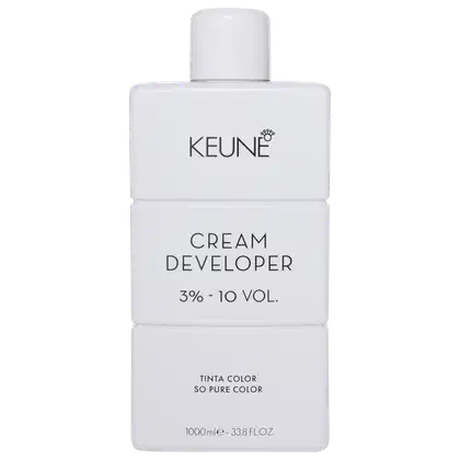 Frasco branco da marca Keune, contendo Cream Developer com 3% - 10 VOL. O rótulo apresenta o nome da marca e do produto em letras pretas.