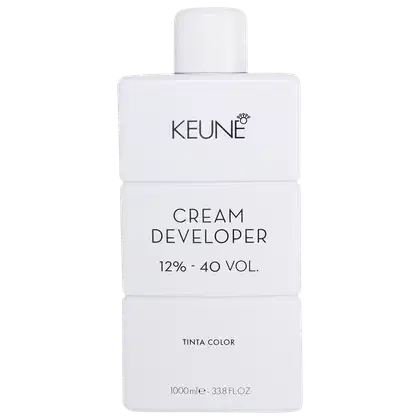 Frasco branco da marca Keune, contendo Cream Developer com 12% - 40 VOL. O rótulo apresenta o nome da marca e do produto em letras pretas.