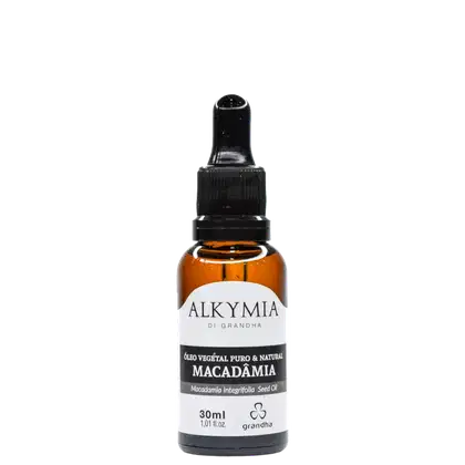 Frasco de óleo vegetal de macadâmia da marca Alkymia, com 30ml de volume, embalagem de vidro âmbar e rótulo branco com texto preto.